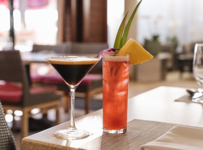 Two cocktails on a table at Surf Lanai.