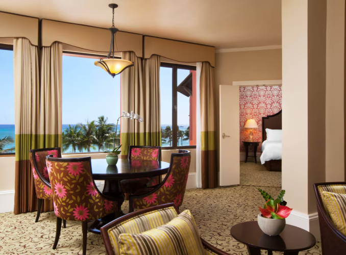 The living and bedroom areas of an ocean-view suite at The Royal Hawaiian.