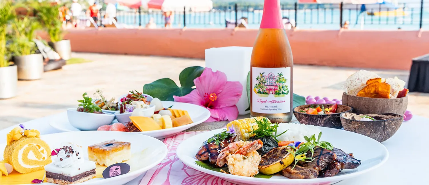 A luau dinner featuring Hawaiian cuisine and sparkling wine