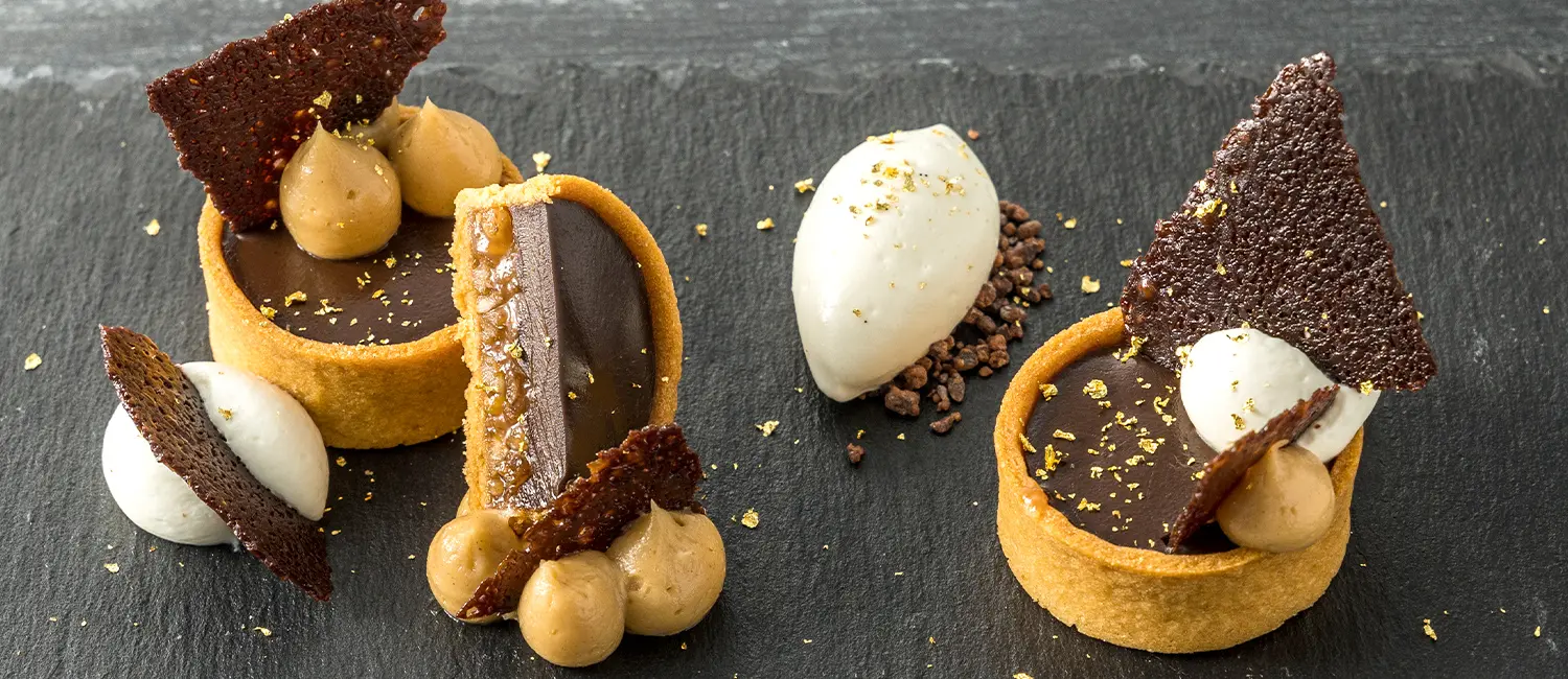 Signature chocolate tart with gold leaf at Azure Restaurant