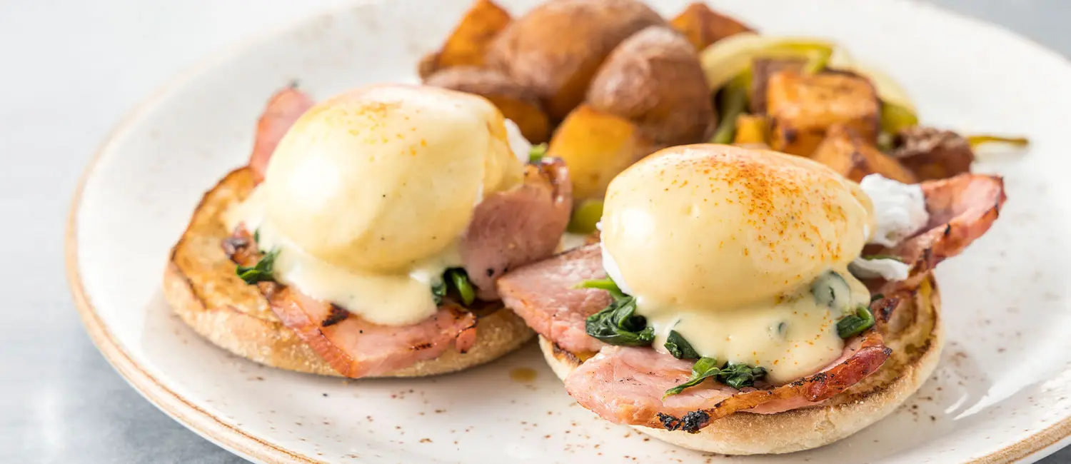 Eggs Benedict breakfast plate at Surf Lanai restaurant