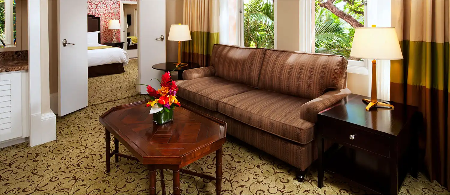 Living area of the Historic Garden Jr Suite featuring a sofa and coffee table.