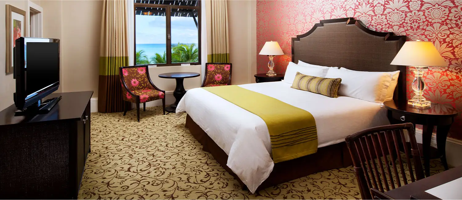 Historic Ocean guest room featuring a king bed and seating area by the window.