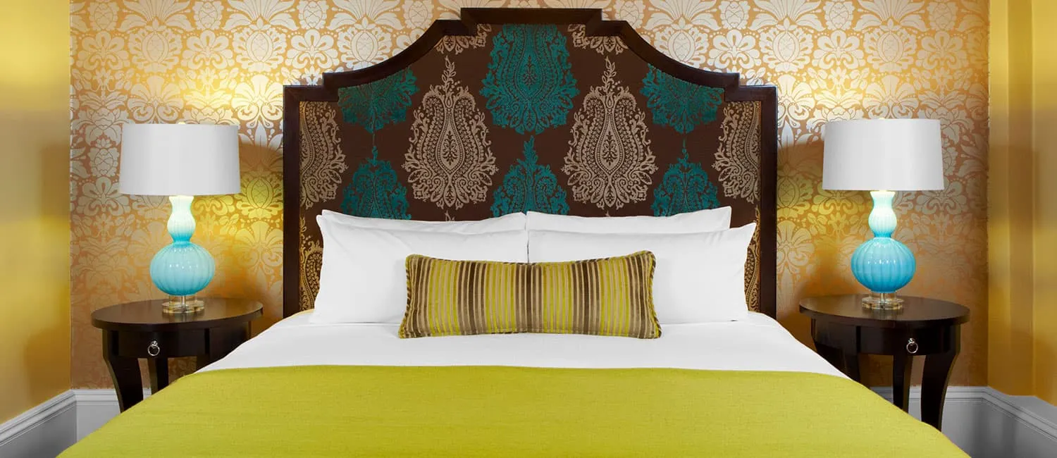 Bright bedroom in yellow and gold tones.