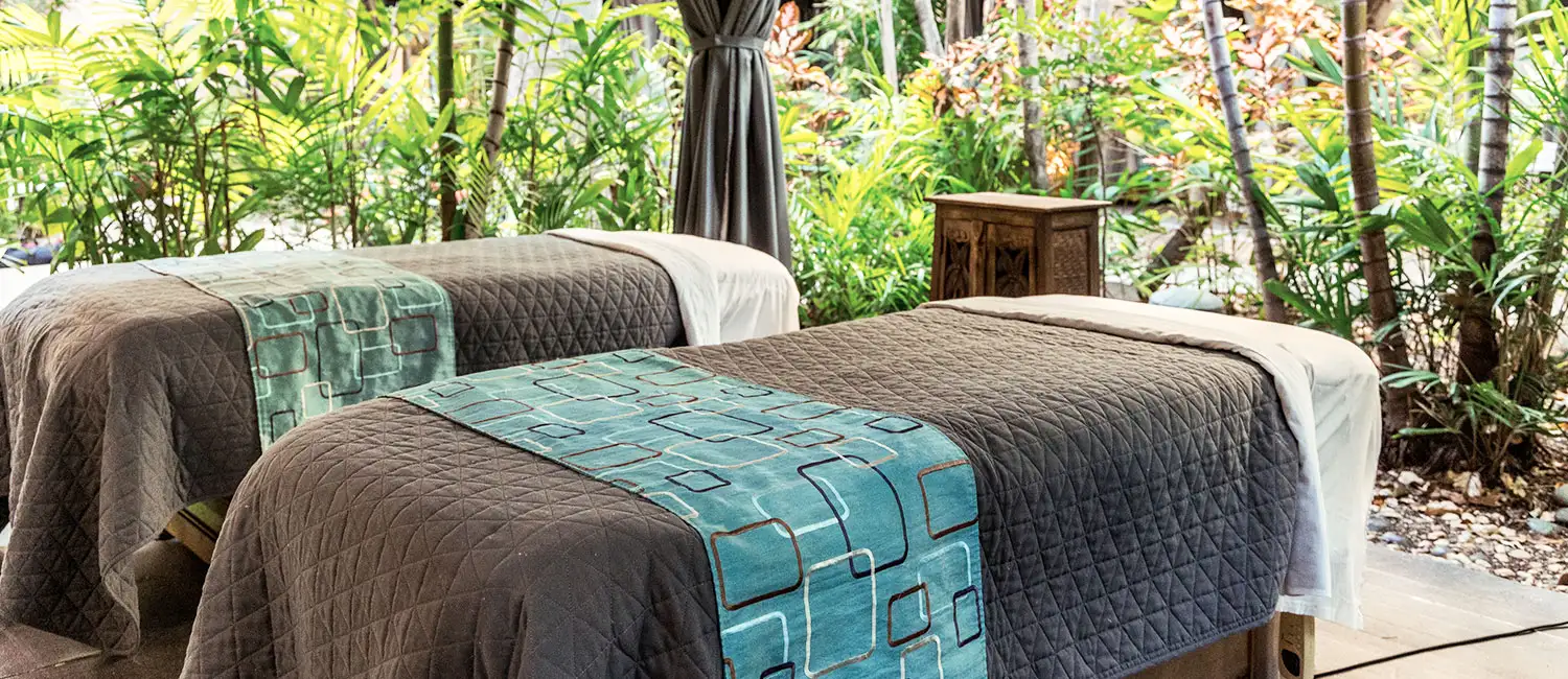 Two beds in a garden cabana, offering a luxurious moment in harmony with nature